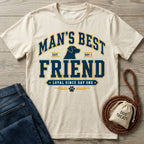 Cream-colored crew neck t-shirt featuring a navy blue Man's Best Friend dog graphic with a paw print on a wooden background.