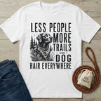 White crew neck t-shirt featuring a black graphic of a dog in the woods with the text Less People More Trails and Dog Hair Everywhere.