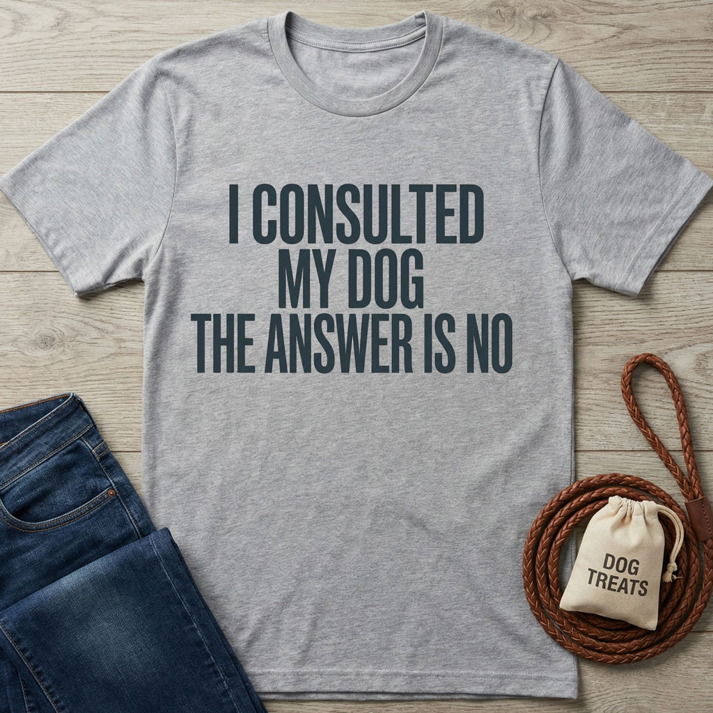 Light grey Gildan Softstyle® t-shirt with "I CONSULTED MY DOG THE ANSWER IS NO" text, next to jeans and dog treats.