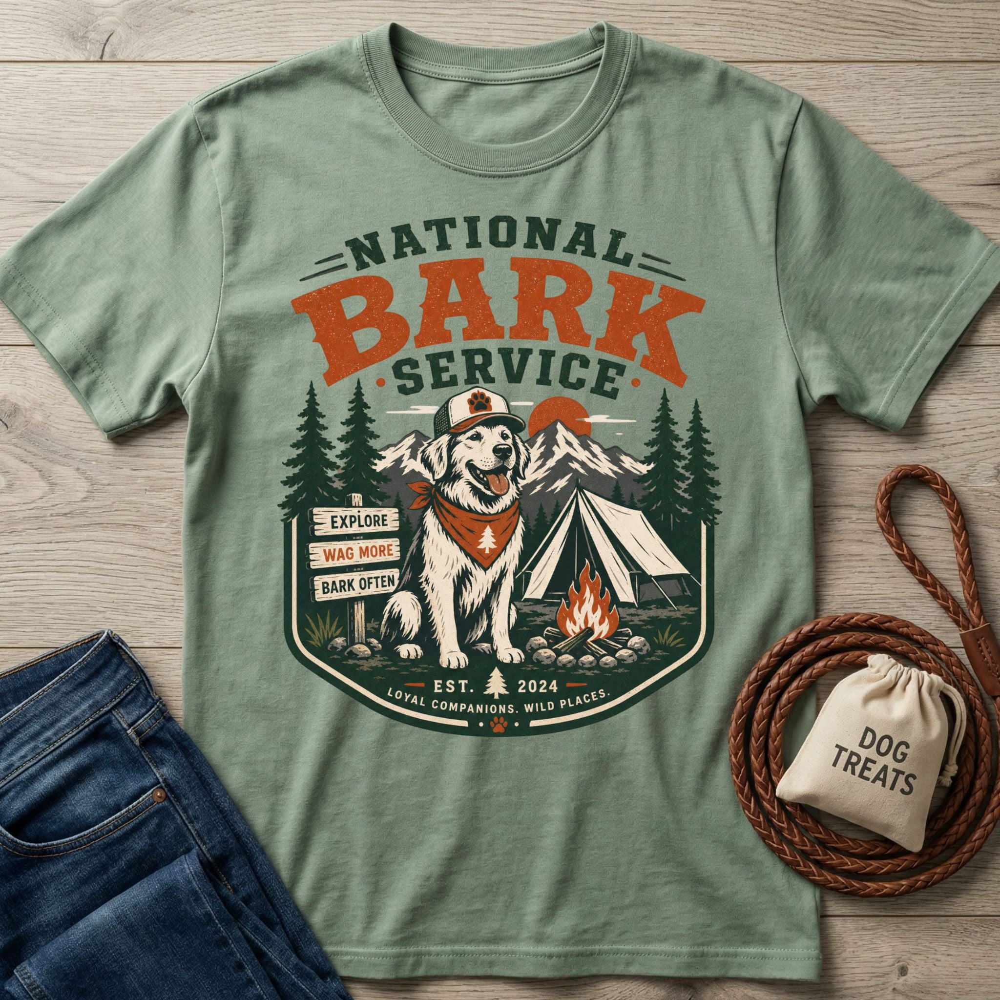 Sage green crewneck t-shirt featuring a National Bark Service graphic with a dog, tent, and campfire print.