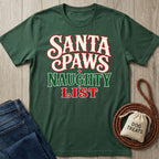 Forest green crewneck T-shirt with Santa Paws Naughty List text in festive red, white, and green holiday typography.