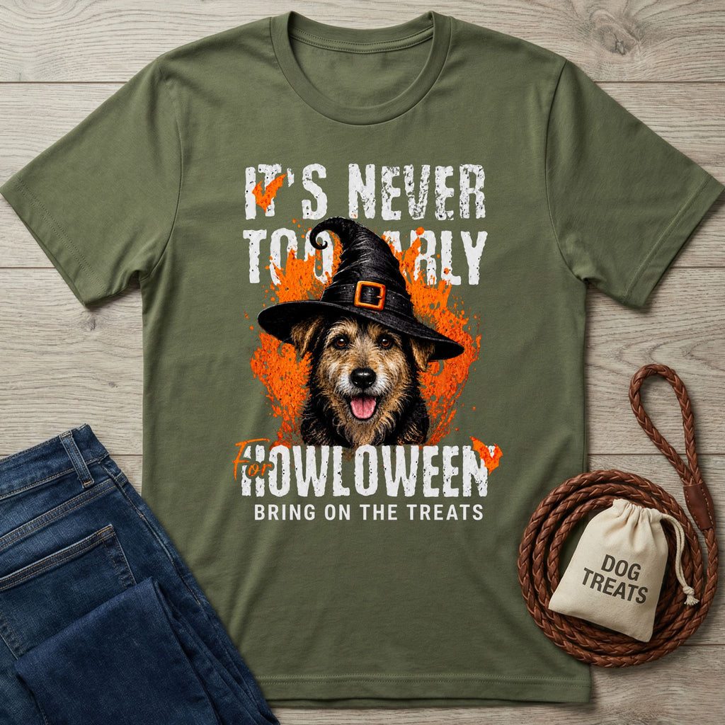 Olive green crewneck t-shirt featuring a dog in a witch hat with orange Halloween graphics and the text It's Never Too Early.