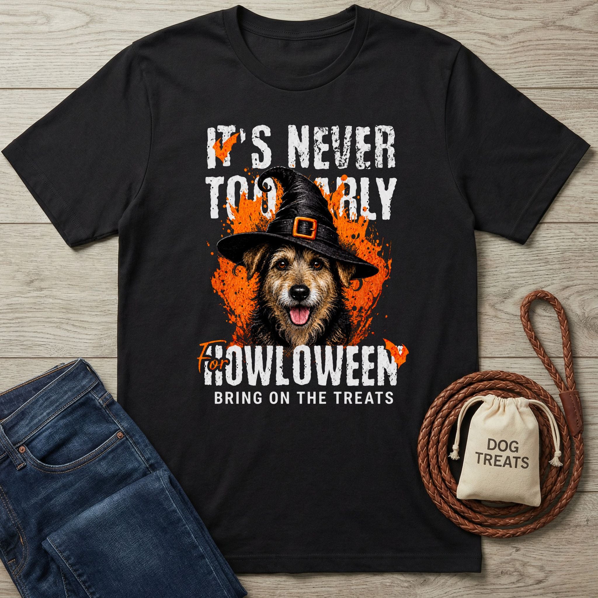 Black crewneck t-shirt featuring a dog in a witch hat with orange Halloween graphics and the text It's Never Too Early For Howloween.