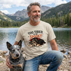 Beige crewneck t-shirt featuring a sleeping vampire dog graphic with text reading Too Tired To Be Spooky.