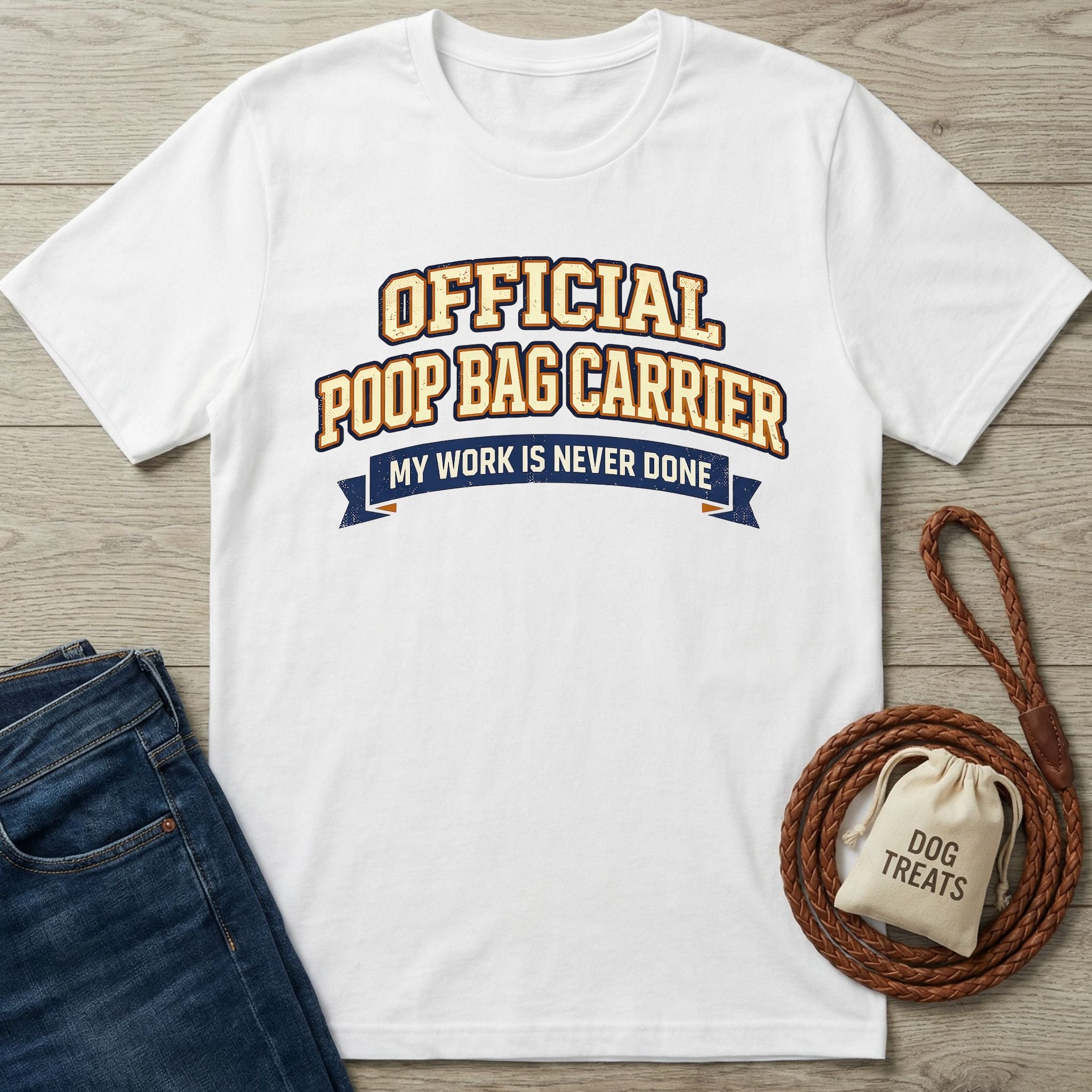 White Gildan Softstyle® t-shirt with "Official Poop Bag Carrier" text, next to jeans and dog leash.