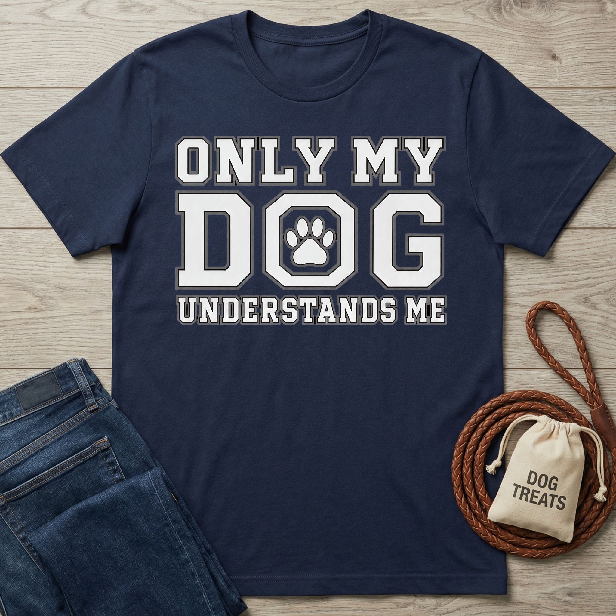 Navy blue cotton t-shirt with white Only My Dog Understands Me text and a paw print graphic on a wooden background.
