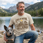 Beige crewneck t-shirt featuring a western graphic of a cowboy, horse, and dog with the text Loyal By Nature Partner For Life.