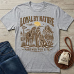 Heather gray crewneck t-shirt featuring a western graphic of a cowboy, horse, and dog with Loyal By Nature text.