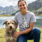 Woman wearing a heather gray crewneck t-shirt featuring a detailed black and white sketch of a dog sitting with a toy.