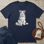 Navy blue cotton t-shirt featuring a detailed white line-art illustration of a dog sitting with a rope toy and ball.