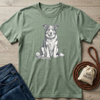 Sage green cotton t-shirt featuring a detailed sketch of a dog sitting patiently with a rope toy and tennis ball.