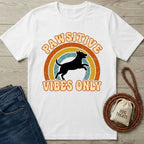 White Gildan Softstyle® 64000 tee with "Pawsitive Vibes Only" text, a jumping dog silhouette, and a retro rainbow.