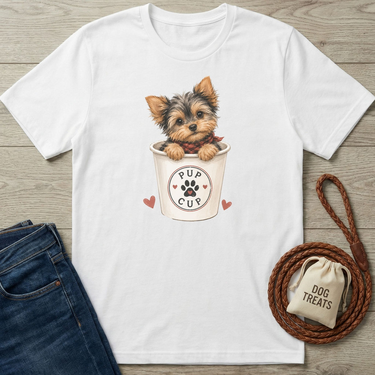 White cotton t-shirt featuring a cute Yorkshire Terrier in a Pup Cup graphic with red hearts on a wooden background.