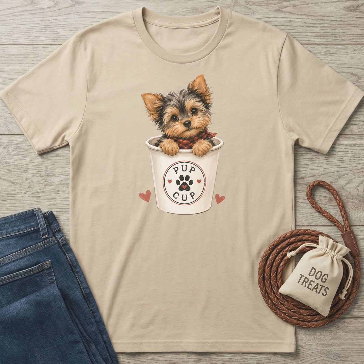 Beige crewneck t-shirt featuring a cute Yorkshire Terrier inside a Pup Cup graphic with paw print and heart details.