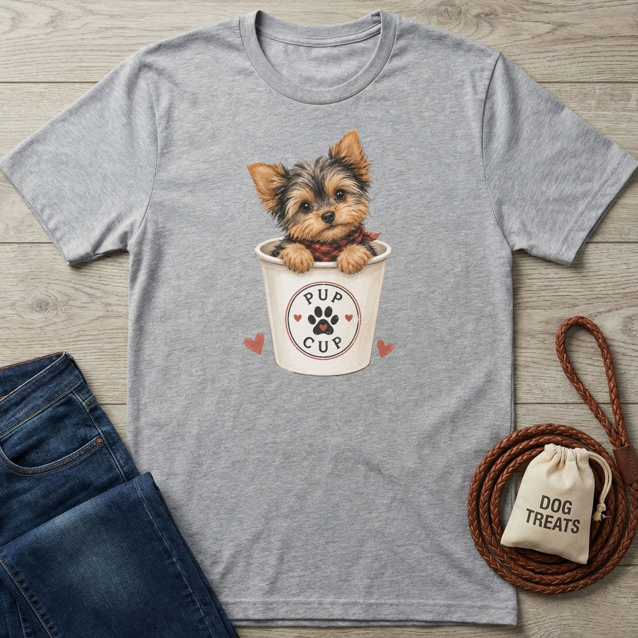 Grey crewneck t-shirt featuring a cute Yorkshire Terrier sitting in a Pup Cup graphic with paw print and heart accents.