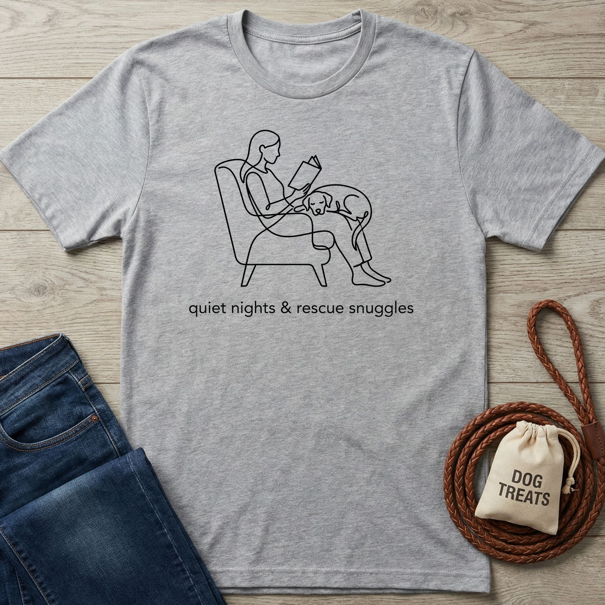 Light grey Gildan Softstyle t-shirt with a black line art graphic of a person reading with a rescue dog.
