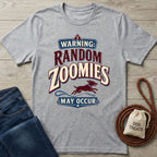 Grey vintage-style t-shirt featuring a red and blue graphic of a running dog with the text Warning: Random Zoomies May Occur.