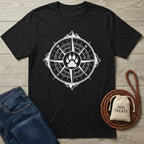 Black t-shirt featuring a white compass design with a central paw print, mountain peak, and jagged border.