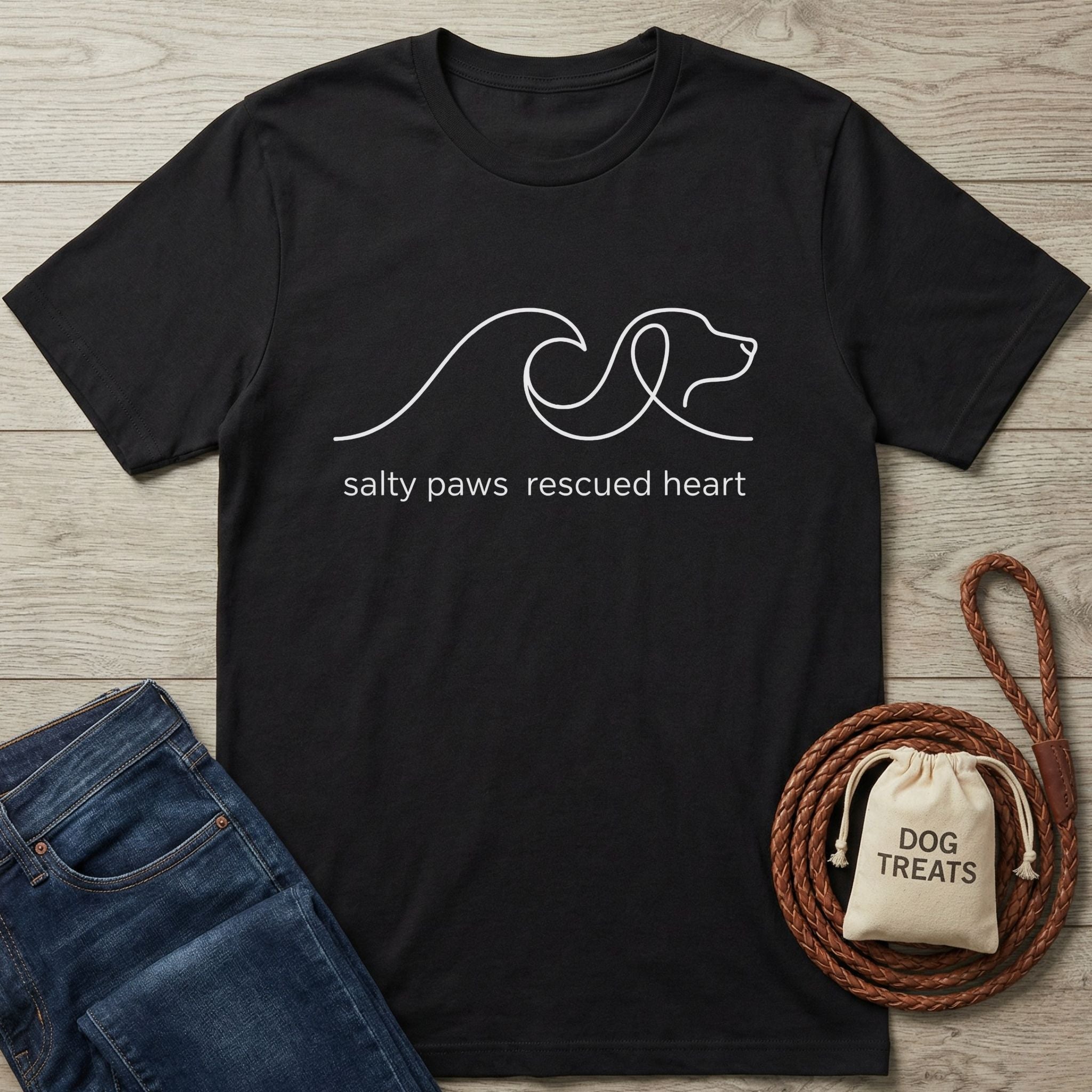 Black Gildan Softstyle® t-shirt with "salty paws rescued heart" and a dog/wave line art design.