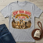 Grey crewneck t-shirt featuring a vintage-style graphic of four dogs in a mountain landscape with the text Sent From Above.