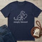 Navy blue Gildan Softstyle® t-shirt with white "simply blessed" text and a dog-heart-cross line art design.