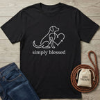 Black Gildan Softstyle® t-shirt with a white line art dog, heart, and "simply blessed" text.