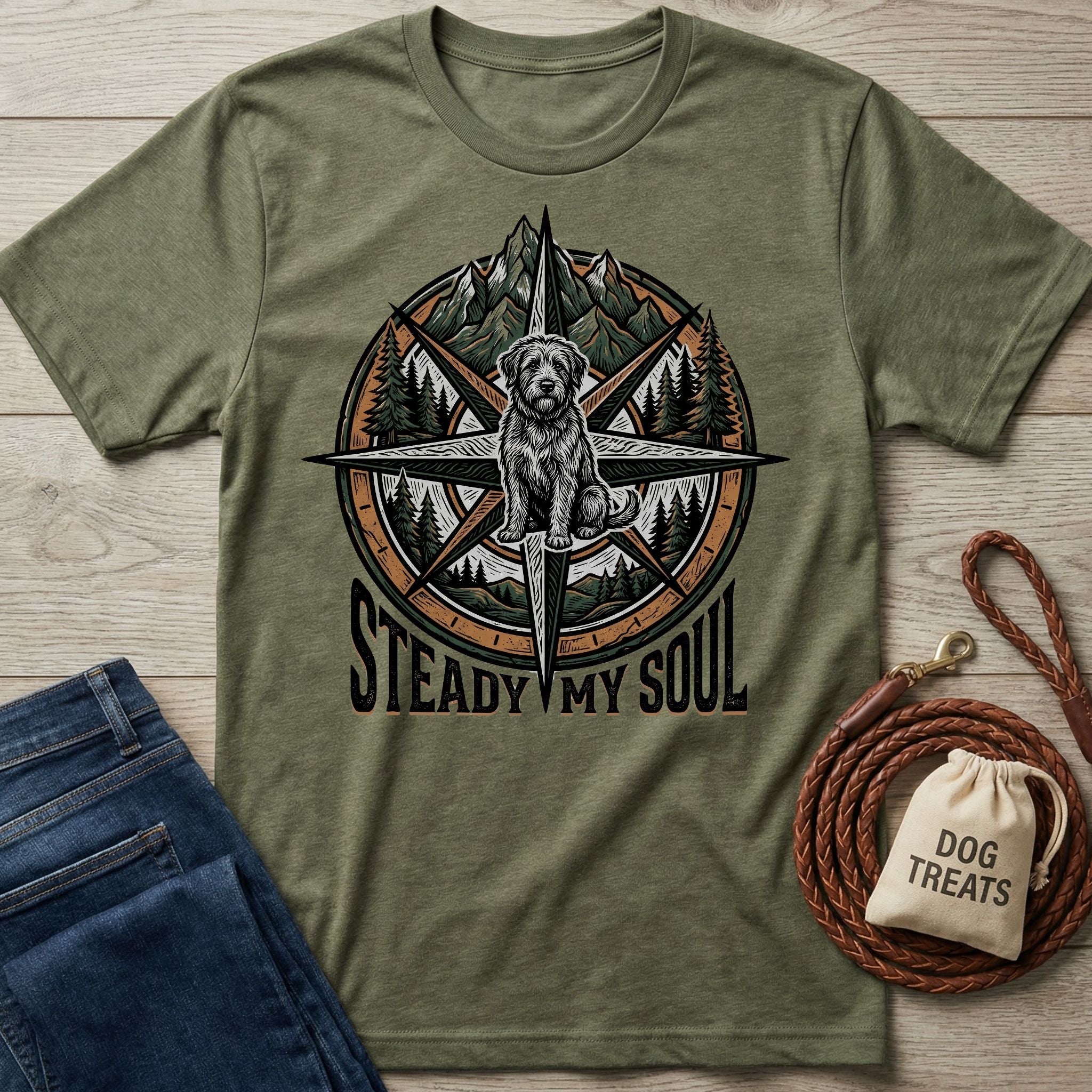 Olive green Gildan Softstyle t-shirt with a compass, mountains, trees, and a rescue dog graphic.