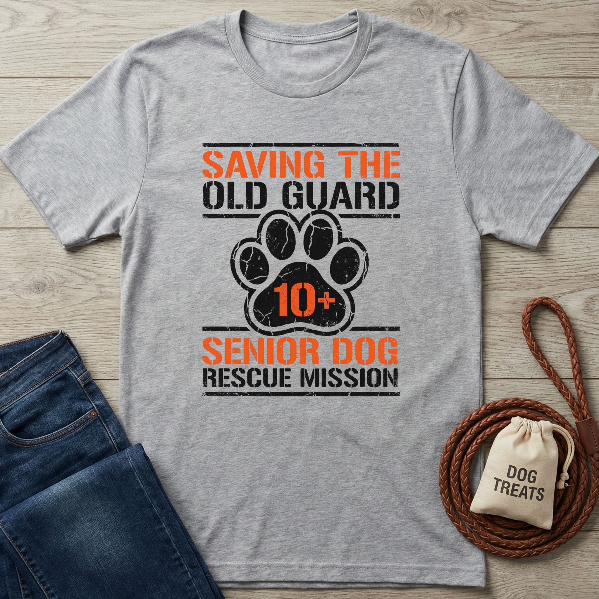 Gray Gildan Softstyle® t-shirt with "Saving The Old Guard Senior Dog Rescue Mission" text and paw print design.