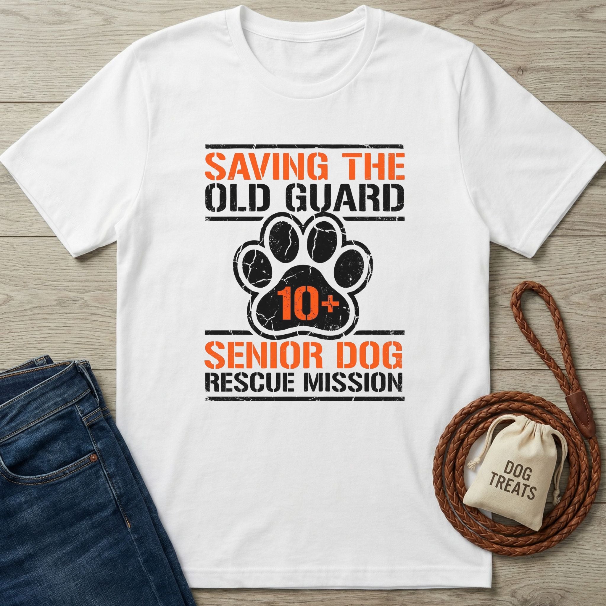 White Gildan Softstyle t-shirt with "Saving The Old Guard Senior Dog Rescue Mission" text and paw print graphic.