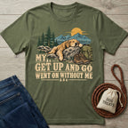 Olive green crewneck t-shirt featuring a sleeping dog, hiking gear, and the text My Get Up And Go Went On Without Me.