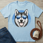 Light blue cotton t-shirt featuring a husky wearing mountain-reflecting sunglasses against a blue circular graphic.