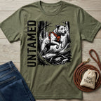 Olive green crewneck t-shirt featuring a graphic of a dog in a harness jumping over a log with the word Untamed.