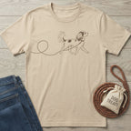 Beige crew neck t-shirt featuring a minimalist brown line drawing of a dog walking on a leash.