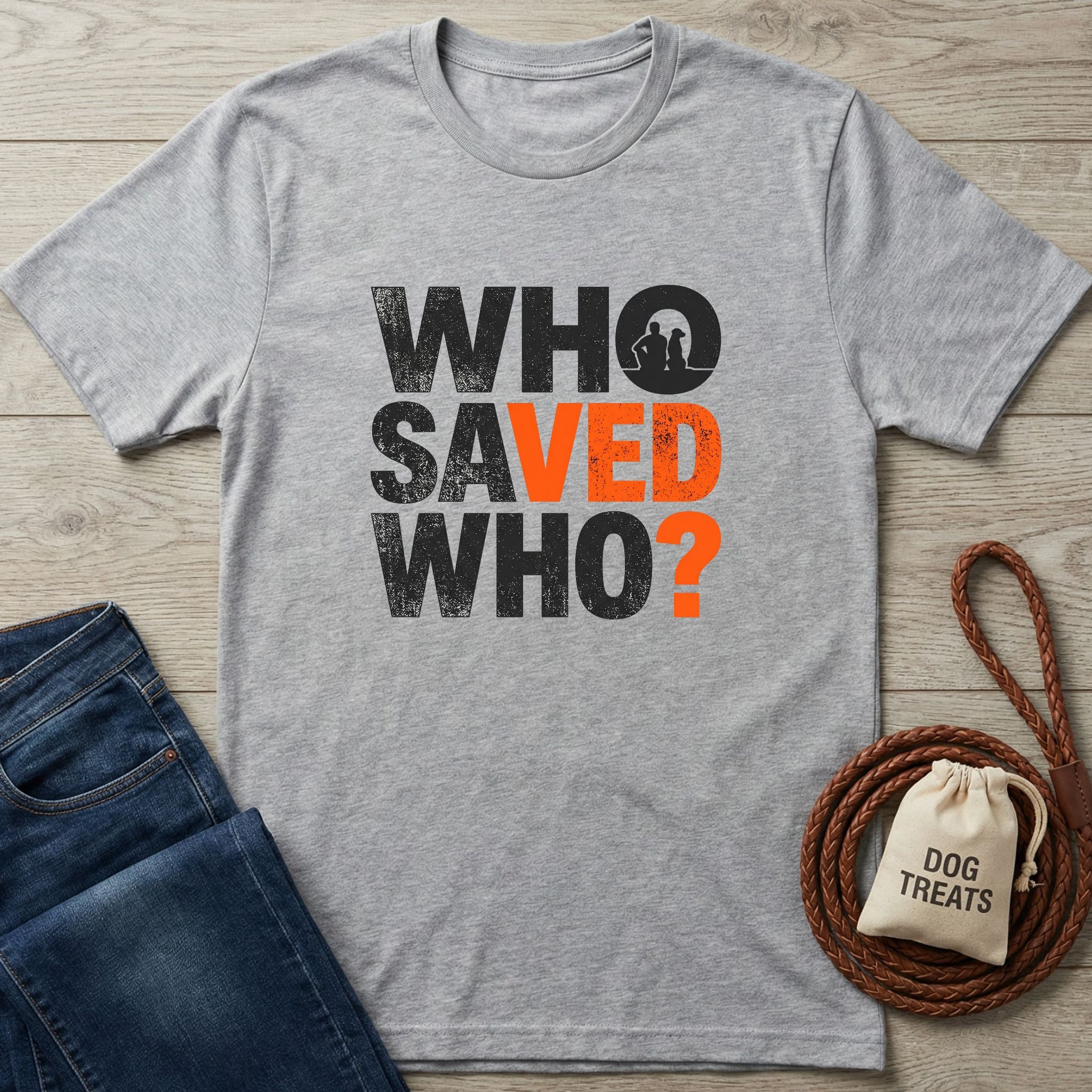 Gray Gildan Softstyle® "Who Saved Who?" t-shirt with orange text, featuring a dog and person silhouette.