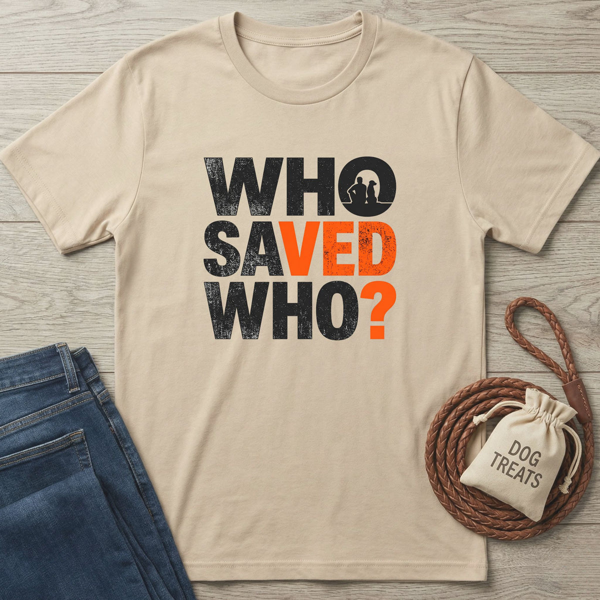 Beige Gildan Softstyle® 64000 tee with "WHO SAVED WHO?" graphic, featuring a dog and person silhouette.